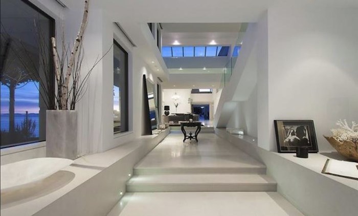  The all-white interiors with soaring ceilings and strips of skylights create a contemporary art gallery vibe. Listing agent: Malcolm Hasman