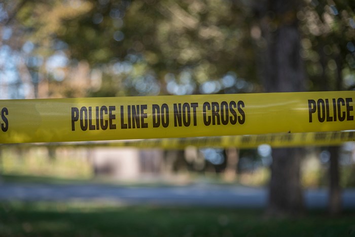  Homicide detectives say they're investigating after two people were found dead inside a home in Surrey, B.C. Police line/Shutterstock