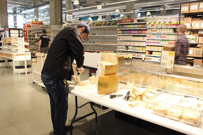  Cutting up the 24-month parmigiano reggiano imported from Italy (Lindsay William-Ross/Vancouver Is Awesome)