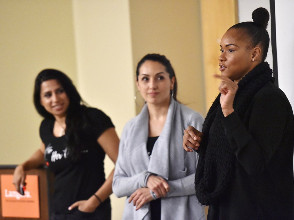  Eboney Chipman, right, speaks a group of sociology students at Langara College, alongside detectives Sandy Avelar and Anisha Parhar. Photo Dan Toulgoet