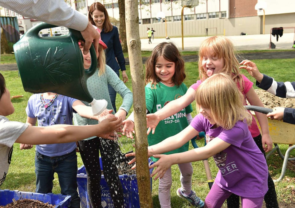  A group of kindergarten students from Lord Nelson school helped out during a tree planting event at Templeton Park Thursday. Since 2010, the city and park board have planted more than 105,000 trees in the city with the goal of reaching 150,000 by 2020. Photo Dan Toulgoet