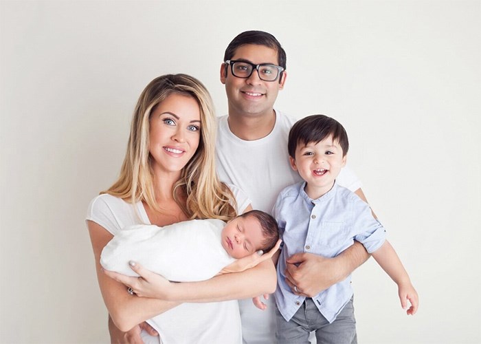  “The Aga Khan is never far from anything we do as a family,” says Farhan Lalani, CEO of Market One Media Group, pictured here with his wife Alison and their sons Cairo and Xavier at their North Vancouver home - photo supplied