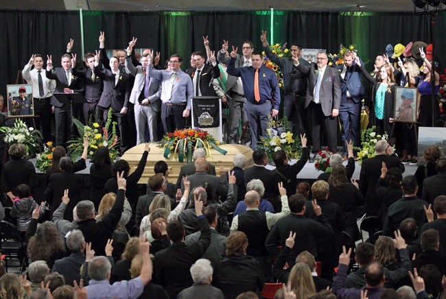  Students and teachers from Winston Churchill High School sing during the funeral service for Humboldt Broncos' Logan Boulet at the Nicholas Sheran Arena in Lethbridge, Alta. on Saturday, April 14, 2018. Nearly 100,000 Canadians signed up to become organ donors after learning a victim of last month's Humboldt Broncos bus crash had signed a donor card just weeks before the crash â€” and wound up saving six lives. THE CANADIAN PRESS/David Rossiter
