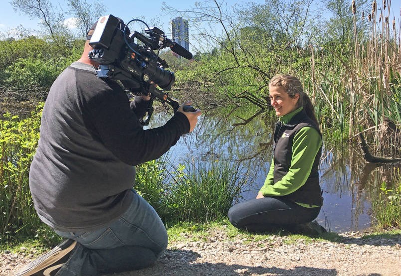  Celina Starnes of the Stanley Park Ecology Society describes how the blob of Lost Lagoon came to be to director of photography Mark Goodhew of the Discovery Channel.