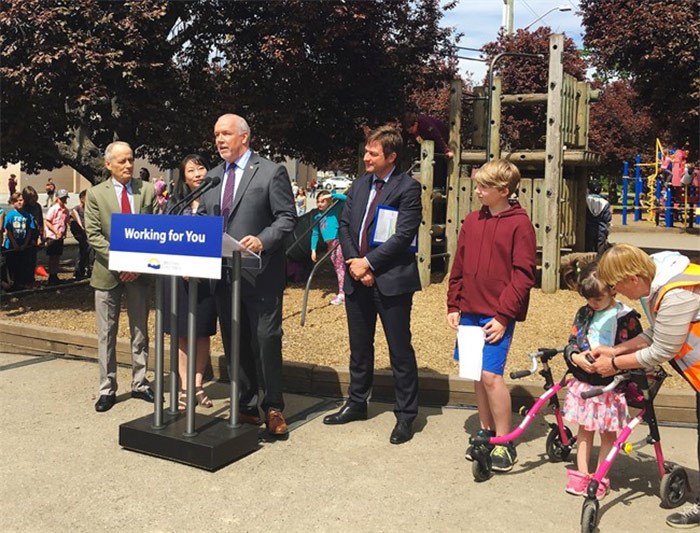  Premier John Horgan speaks during an announcement at Quadra Elementary School in Victoria on Tuesday, May 8, 2018. The B.C. government says it will invest $5 million to build and renovate playgrounds at schools. Premier John Horgan says parent advisor councils no longer have to hold bake sales and raffles to raise money for new playgrounds. THE CANADIAN PRESS/Dirk Meissner