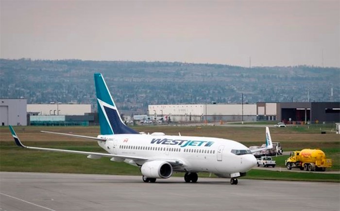  WestJet pilots voting overwhelmingly to give its union a strike mandate. WestJet planes are seen at the Calgary Airport in Calgary, Alta., Thursday, May 10, 2018.THE CANADIAN PRESS/Jeff McIntosh