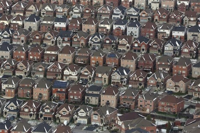  Aerial view of houses in Oshawa, Ont., seen from a Canadian forces Hercules on Saturday, Nov. 11, 2017. The Canadian Real Estate Association says national home sales sank to the lowest level in more than five years, falling by 13.9 per cent year-over-year in April. THE CANADIAN PRESS/Lars Hagberg