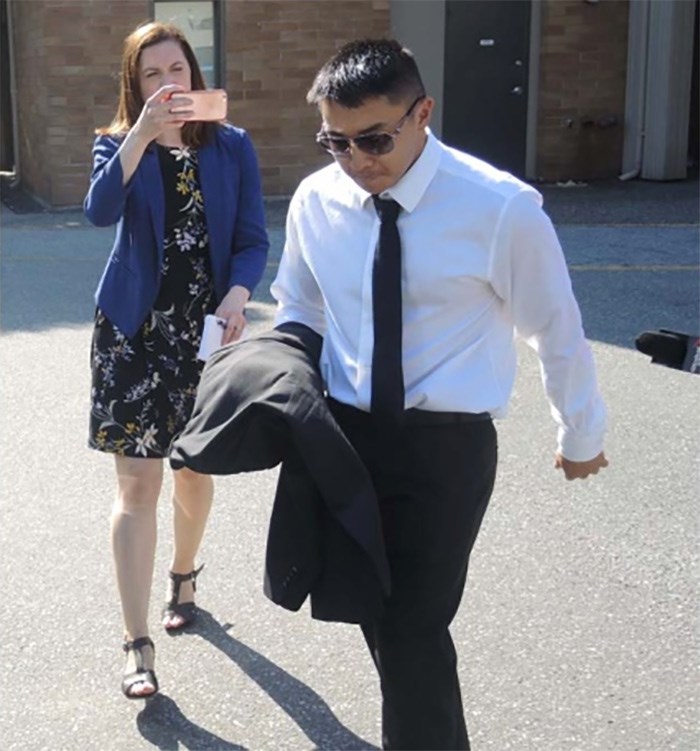  Michael Fan dashes from court via a side door after being sentenced to a fine and a driving ban for causing the death of cyclist Brad Dean on River Road in Richmond