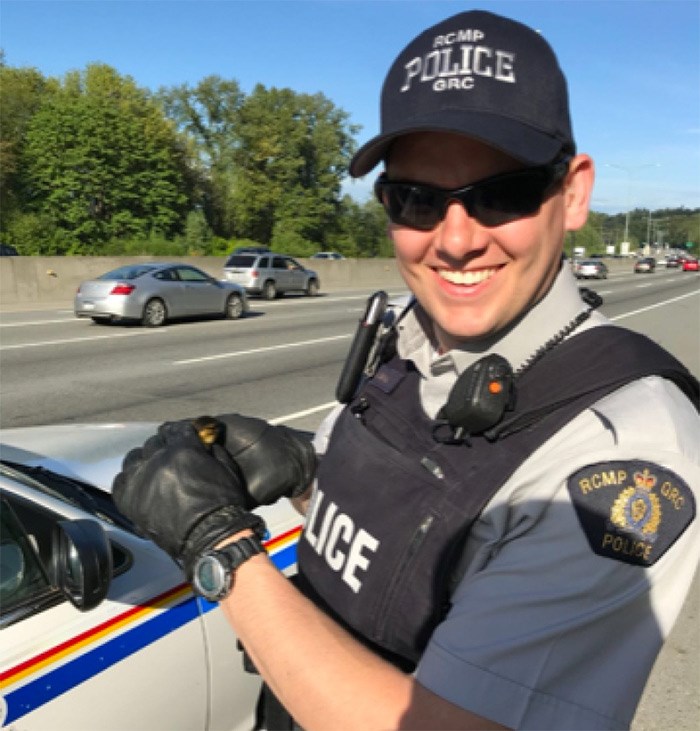  Const. Jonathan Gillis holds a duckling rescued from Highway 1 after its mother was killed. Gillis transported the unfortunate bird to the Wildlife Rescue Association.