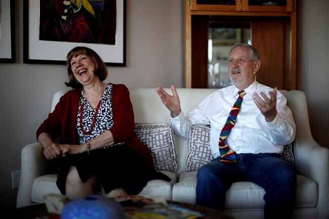  David Spence is the president of the Royal Commonwealth Society and organizer of a wedding reception being held on the same day as Prince Harry and Meghan Markle. He's photographed sharing a laugh with his wife Donna Otto during an interview at home in Brentwood Bay, B.C., on Monday, May 7, 2018. THE CANADIAN PRESS/Chad Hipolito