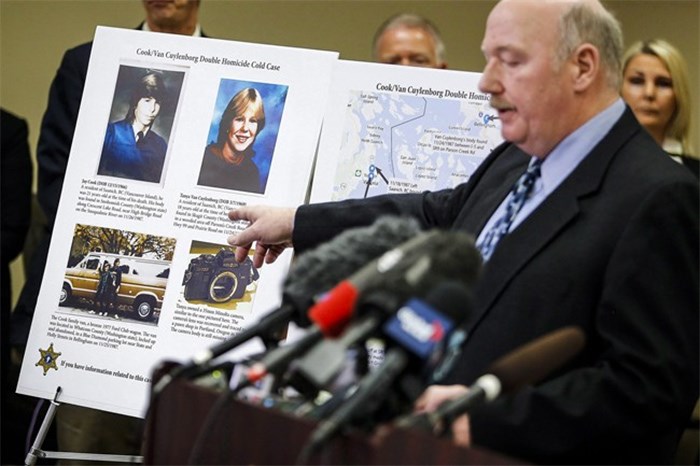 Snohomish County Cold Case Detective Jim Scharf, right, shares details of the unsolved case of the 1987 double homicide of Jay Cook and Tanya Van Cuylenborg, during a press conference in Everett, Washington on Wednesday, April 11, 2018. THE CANADIAN PRESS/AP-Ian Terry /The Herald via AP)