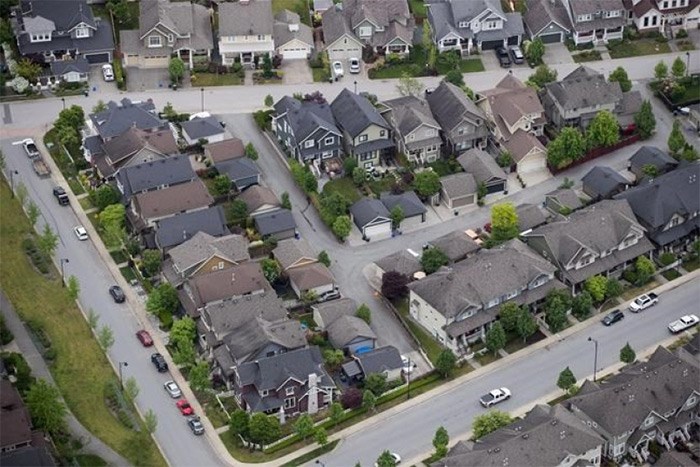 Houses and townhouses are seen in an aerial view, in Langley, B.C., on Wednesday May 16, 2018. Canada's big banks are locked in a competitive pricing war over variable-rate mortgages, but economic trends point to more interest rate hikes ahead — leaving Canadian mortgage borrowers struggling to interpret the mixed messages. THE CANADIAN PRESS/Darryl Dyck