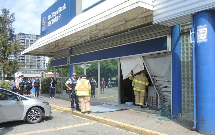  A fire crew inspects the scene of the crash on Friday morning at the RBC bank on Ackroyd Road