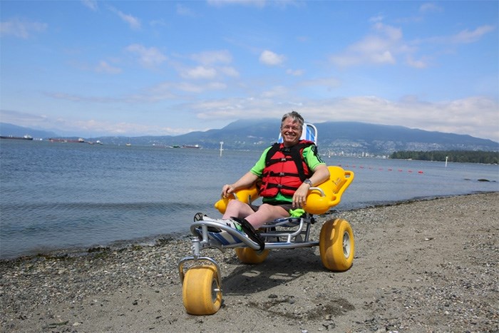  Jacques Courteau, co-chair of the City of Vancouver Persons with Disabilities Advisory Committee, tried out one of the park board’s new water wheelchairs. Photo Vancouver Park Board