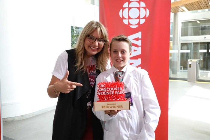  CBC Vancouver’s Johanna Wagstaffe congratulates Keenan Warhurst on his win at the Science Fair.