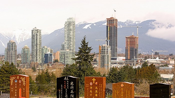  Skyscrapers loom over Forest Lawn Cemetery in Burnaby, highlighting pressure felt by the funeral services industry by shrinking availability of burial properties and high land costs | Chung Chow