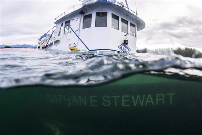  The tugboat Nathan E. Stewart is seen in the waters of the Seaforth Channel near Bella Bella, B.C., in an October 23, 2016, handout photo. Results are expected today from an investigation into what caused a tugboat to crash and sink off British Columbia's coast in 2016, spilling thousands of litres of fuel into the ocean. THE CANADIAN PRESS/HO-Heiltsuk First Nation, April Bencze.