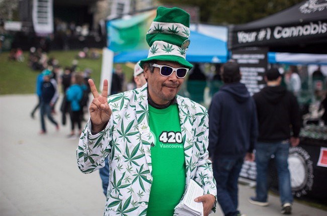  A man sporting a jacket and hat bearing images of marijuana gestures during the 4-20 annual marijuana celebration, in Vancouver, B.C., on Friday April 20, 2018. An amendment to the Cannabis Act/Bill C-45 recently passed by the Senate that would prohibit the use of cannabis brand elements on promotional items that are not cannabis or cannabis accessories. THE CANADIAN PRESS/Darryl Dyck