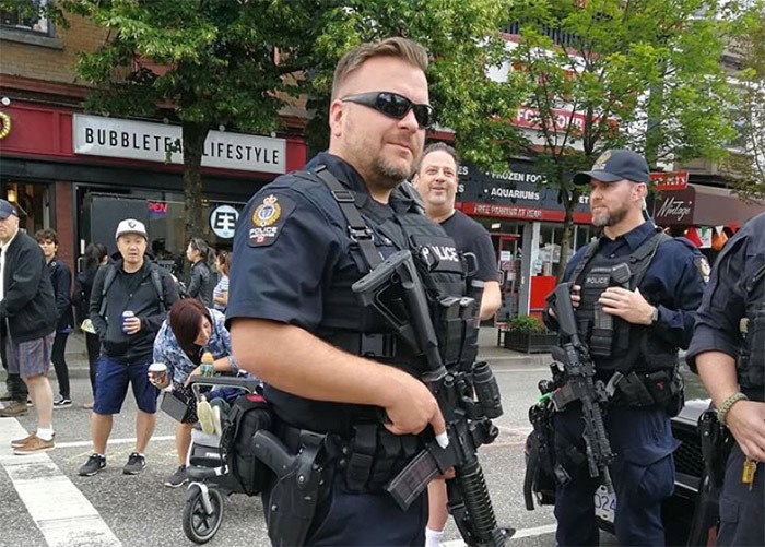  Vancouver PD ERT members carrying Colt C8 carbine rifles at Italian Day on the Drive. Courtesy of Twitter @VanAlias / Adrienne Smith