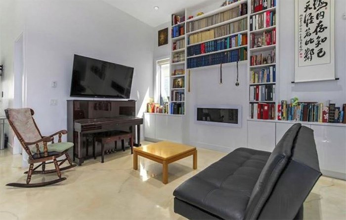  The living area of this open-concept main floor offers a nod to a stately library, but remains contemporary. Listing agent: David Caron