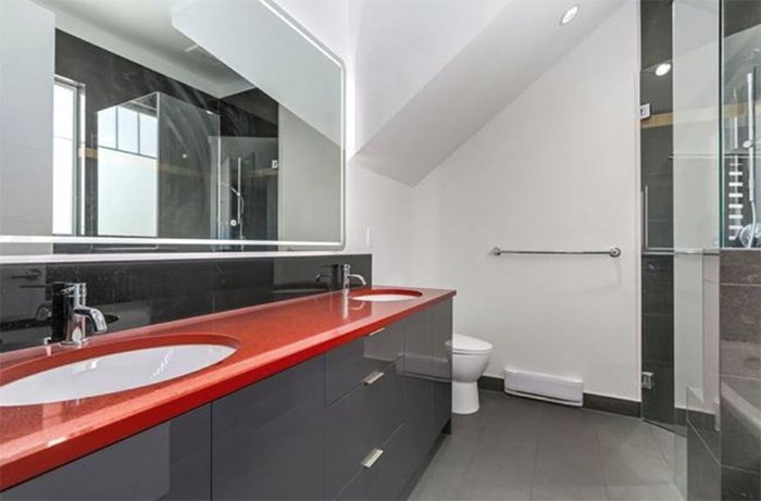  If you thought the main floor of this house was modern, check out this bathroom. Listing agent: David Caron