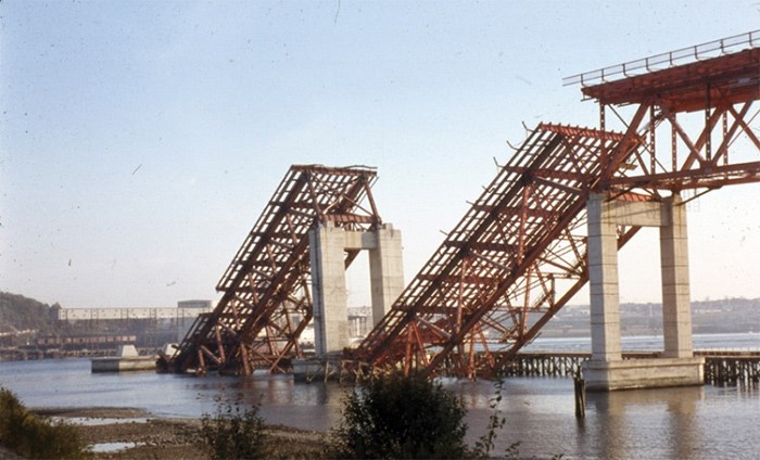  Two spans of the Second Narrows Bridge sit stuck in Burrard Inlet following the bridge’s collapse during construction on June 17, 1958. Eighteen men died in the collapse and another was killed days later while diving to recover a body. photo supplied North Vancouver Museum and Archives