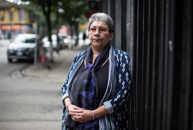  Downtown Eastside resident Elaine Durocher poses for a photograph in Vancouver, on Thursday June 14, 2018. Indigenous and civil rights groups have asked British Columbia's police complaints commissioner to investigate a significant racial disparity in the Vancouver Police Department's use of street checks. The Union of B.C. Indian Chiefs and the B.C. Civil Liberties Association say Indigenous and black people are over-represented in the police practice, often referred to as carding. THE CANADIAN PRESS/Darryl Dyck