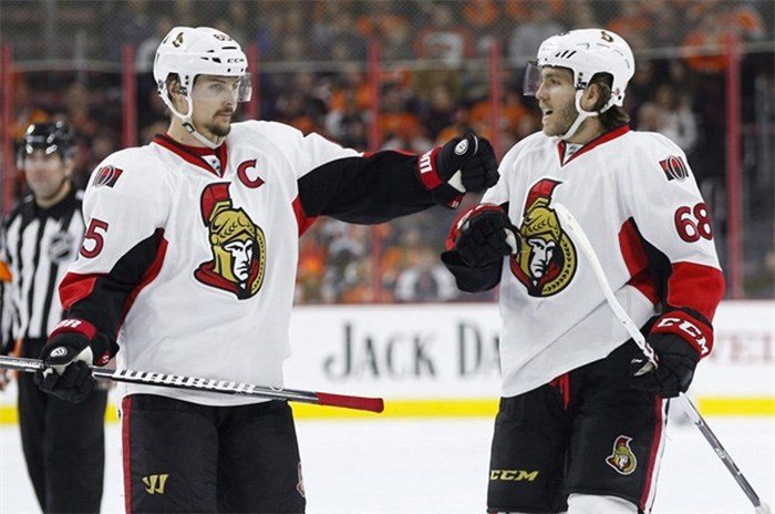  Ottawa Senators' Mike Hoffman (68) celebrates his power play goal with Erik Karlsson (65), of Sweden, during the third period of an NHL hockey game against the Philadelphia Flyers in Philadelphia on April 2, 2016. The Ottawa Senators have traded forward Mike Hoffman less than one week after a story broke about his partner's alleged harassment of team captain Erik Karlsson's wife.The Senators announced Tuesday they have traded Hoffman, prospect defenceman Cody Donaghey and a fifth-round pick in the 2020 draft to the San Jose Sharks for forward Mikkel Boedker, defenceman Julius Bergman and a sixth-round pick in the 2020 draft. THE CANADIAN PRESS/AP, Chris Szagola
