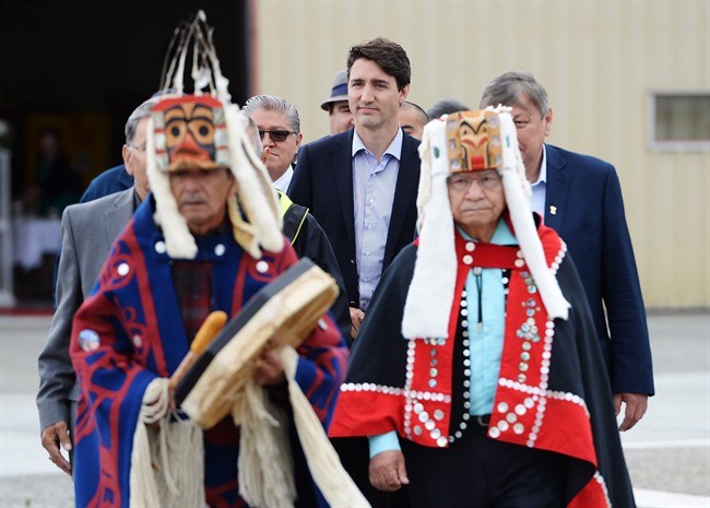  Prime Minister Justin Trudeau is led out to an event by Indigenous drummers in Prince Rupert, B.C. on Thursday, June 21, 2018. THE CANADIAN PRESS/Jonathan Hayward