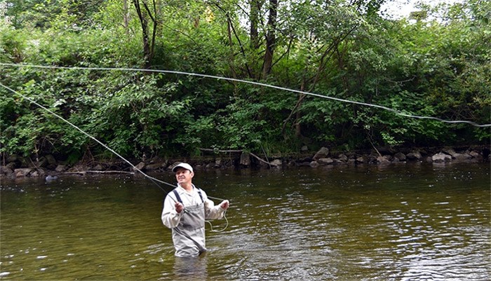  Lorenzo Cirillo casts his line into the Coquitlam River to demonstrate fly fishing techniques. The veteran middle school teacher will be moving to Gleneagle secondary this fall and one of the new courses he hopes to teach is Fly Fishing 11.   Photograph By Diane Strandberg