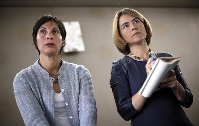  United Nations human rights experts Leilani Farha and Catarina de Albuquerque listen to questions during a news conference in Detroit, Monday, Oct. 20, 2014. Farha, a United Nations housing watchdog, is taking the Liberals to task over what she see as the government's about-face on a promise to put a human rights lens on its housing strategy. THE CANADIAN PRESS/AP/Paul Sancya