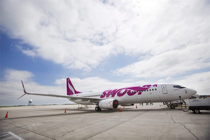  A Swoop Airlines Boeing 737 is on display during their media event, Tuesday, June 19, 2018 at John C. Munro International Airport in Hamilton, Ont. THE CANADIAN PRESS/Tara Walton