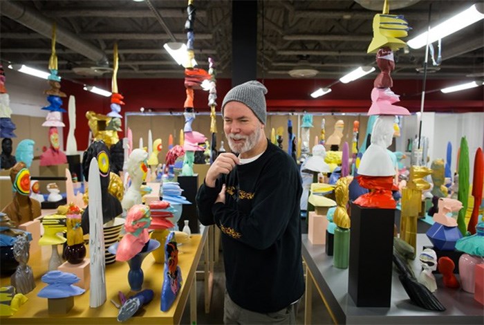  Artist Douglas Coupland smiles while organizing his latest work 