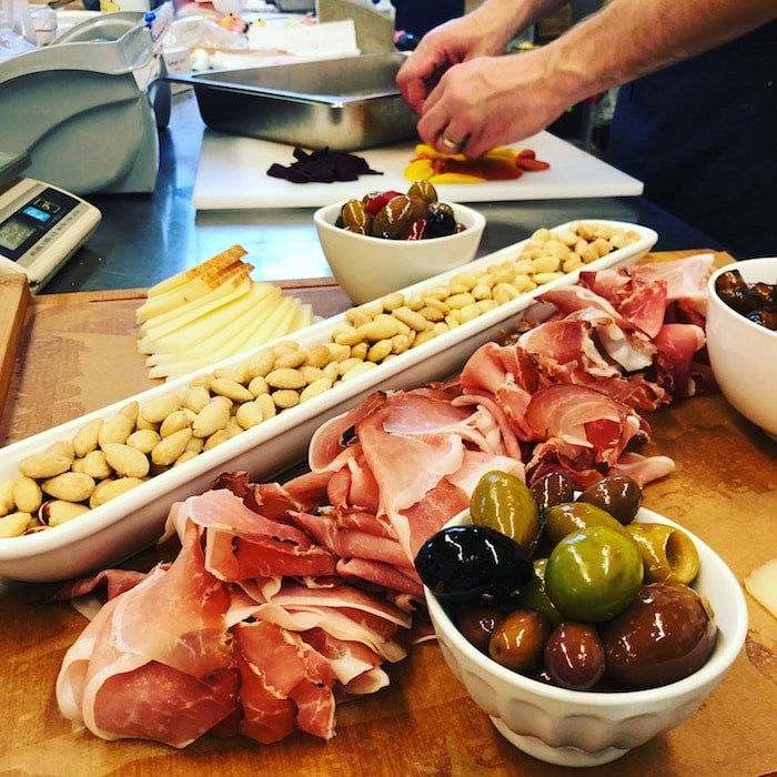  Assembling a charcuterie board (Photo courtesy Savoury Chef)