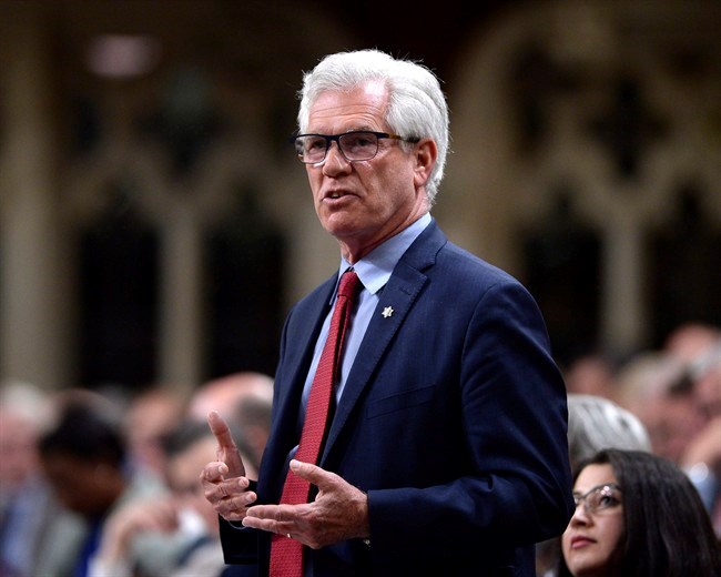  Minister of Natural Resources Jim Carr rises during Question Period in the House of Commons on Parliament Hill in Ottawa on Tuesday, May 29, 2018. Natural Resources Minister Jim Carr says Canada's pathway to a clean energy future includes not only transitioning to renewable sources of energy but also technology that makes traditional fossil fuels cleaner to both produce and burn. THE CANADIAN PRESS/Justin Tang
