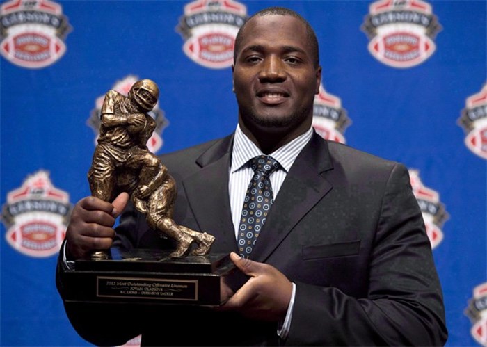  B.C. Lions offensive tackle Jovan Olafioye holds the trophy for Most Outstanding Offensive lineman trophy as he poses for photographers during the CFL awards show in Toronto Thursday, November 22, 2012. Vancouver's notoriously tough housing market is posing problems for at least one professional football player. Offensive lineman Jovan Olafioye has been struggling to lock down a rental home since he returned to the B.C. Lions in May. THE CANADIAN PRESS/Sean Kilpatrick