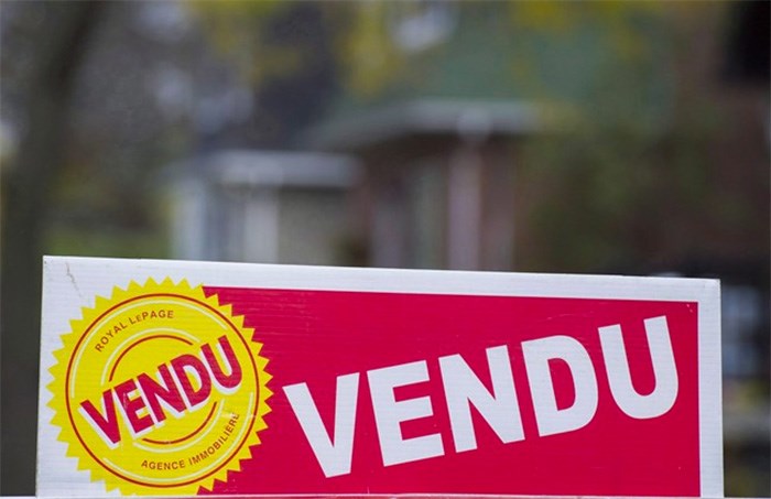  A sign meaning sold is shown on the west island of Montreal on November 4, 2017. The Greater Montreal Real Estate Board says home sales in that city for June were up one per cent compared with the same month last year, marking a record 40 consecutive months of rising home sales. The board says sales totalled 4,081 for the month, up from 4,055 in June 2017. THE CANADIAN PRESS/Graham Hughes