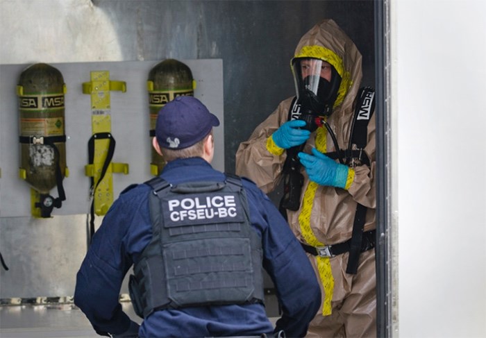  Crews decontaminate an apartment in a Prenter Street complex in 2016 after a large clandestine drug processing lab was discovered inside.