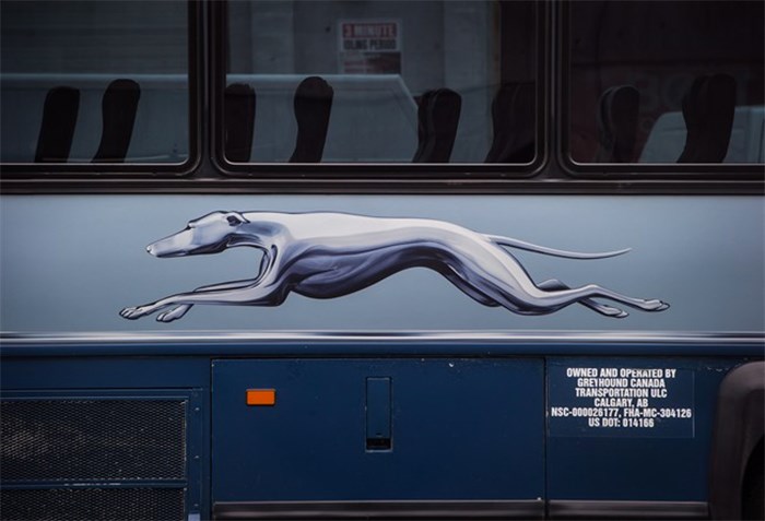  The Greyhound logo is seen on one of the company's buses, in Vancouver, on Monday July 9, 2018. Greyhound Canada says it is ending its passenger bus and freight services in Alberta, Saskatchewan and Manitoba, and cancelling all but one route in B.C. -- a U.S.-run service between Vancouver and Seattle. As a result, when the changes take effect at the end of October, Ontario and Quebec will be the only regions where the familiar running-dog logo continues to grace Canadian highways. THE CANADIAN PRESS/Darryl Dyck