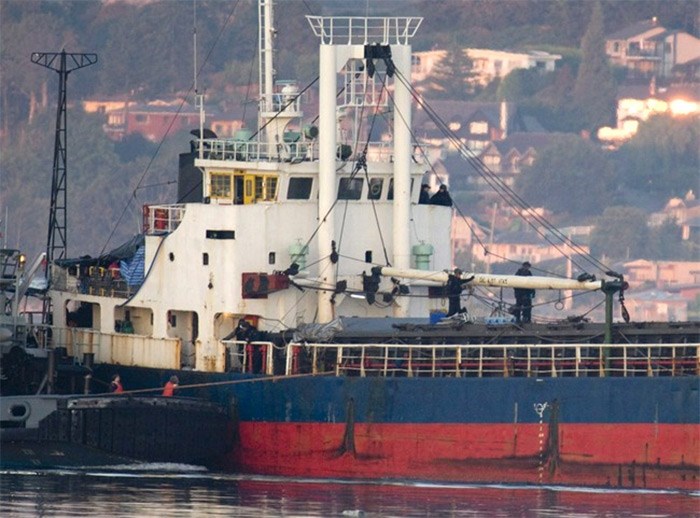  Members of the RCMP are seen standing on the deck and bridge of the MV Sun Sea as it is escorted into CFB Esquimalt, adjacent to the western limit of Victoria, Friday, Aug. 13, 2010. The MV Sun Sea carried nearly 500 Tamil migrants to Canada eight years ago, but now the rusting cargo ship sits forlornly on the B.C. coast â€” an unwanted vessel of toxins including asbestos, PCBs and mould, documents reveal. THE CANADIAN PRESS/Jonathan Hayward