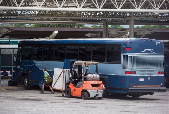  Package delivery firms say they are prepared to fill the gap when Greyhound Canada closes most of its Western Canada operations this October. A worker removes luggage from a Greyhound bus upon arrival in Vancouver on Monday, July 9, 2018. THE CANADIAN PRESS/Darryl Dyck