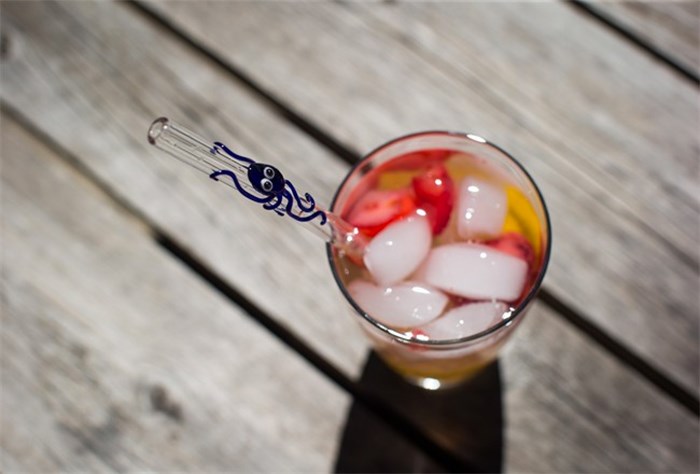  A glass straw is seen in a drink at Aimee Promislow and Fred Tischler's home where they operate their glass straw company, Glass Sipper, in Vancouver, on Wednesday July 11, 2018. THE CANADIAN PRESS/Darryl Dyck