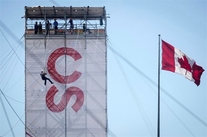  A visitor slides down a zip line during the Calgary Stampede in Calgary, Sunday, July 8, 2018. The Calgary Stampede says its annual display of Indigenous culture that goes back over 100 years will no longer be called Indian Village. On Sunday, the final day of the 2018 Calgary Stampede, officials announced the village of more than two dozen teepees will be called Elbow River Camp.THE CANADIAN PRESS/Jeff McIntosh