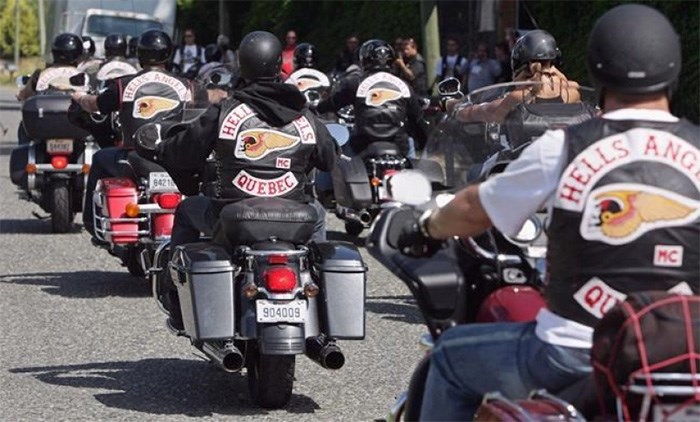  Quebec members of the Hell's Angels motorcycle gang arrive at the White Rock, B.C., chapter's property in Langley, B.C., on Friday July 25, 2008. THE CANADIAN PRESS/Darryl Dyck