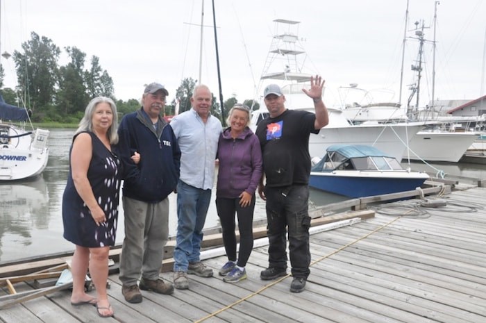  Roberto Farinha (Far right), founder of Richmond Harbour Ferry, works with president of Bridges Marina Paul Palmer (third left) and his staff to build Richmond’s private pedestrian ferry system. Daisy Xiong photo