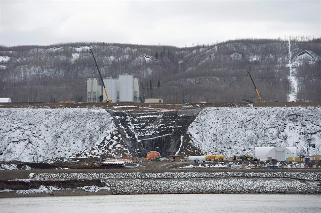 The Site C Dam location is seen along the Peace River in Fort St. John, B.C., on April 18, 2017. British Columbia's mammoth Site C hydro-electric project is seriously behind schedule, plagued by quality problems and marked by secrecy, says an assessment by an international dam expert. THE CANADIAN PRESS/Jonathan Hayward