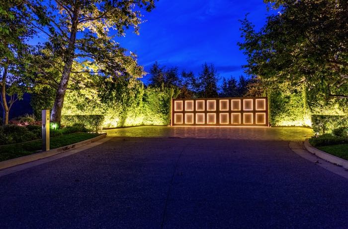  There's no mansion, but the property has a security wall and imposing gate. Listing agent: Aaron Kirman, photo by Beth Coller via Forbes.com