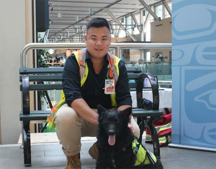  Pilotand his handler, Josh Ng. Photo: Alyse Kotyk