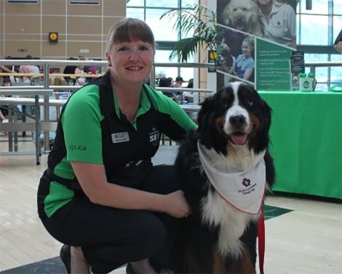  Branston with his handler Yvonne Jackson. Photo: Alyse Kotyk