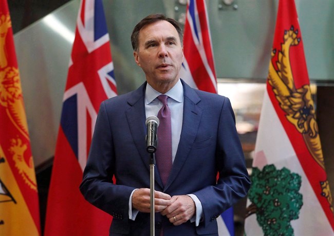  Finance Minister Bill Morneau speaks with reporters before a meeting with provincial and territorial finance ministers in Ottawa on June 26, 2018. An internal federal analysis is forecasting job market moderation on the horizon following Canada's extended period of healthy employment growth. The assessment prepared last spring for Finance Minister Bill Morneau is predicting job creation to continue fading over the near term for a number of reasons -- the economy has been running at full capacity, the unemployment rate has bottomed out near a four-decade low and the aging population is applying downward pressure. THE CANADIAN PRESS/Patrick Doyle